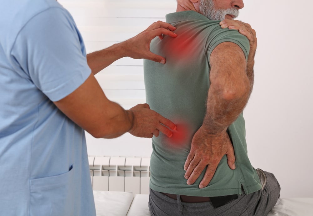senior man back pain spine physical - Top 5 Myths About Fascial Stretch Therapy Debunked