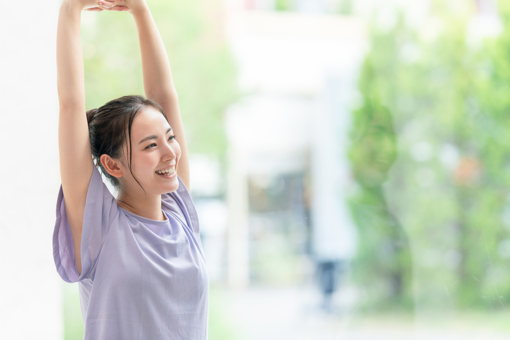 Young Asian woman practicing Fascial Stretch Therapy for healthcare and body wellness.
