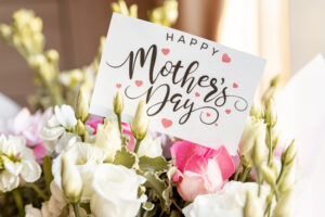 Flowers with a card saying Happy Mother's Day - massage therapist in metairie